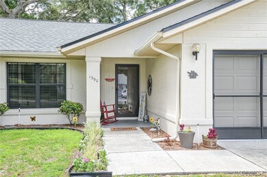 Covered Porch With New Glass Storm Door.