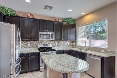 Kitchen with appliances with stainless steel finis