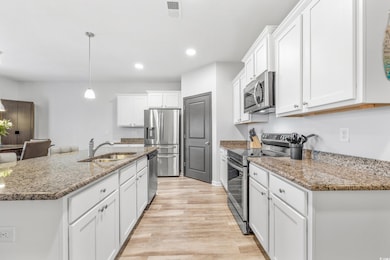 Kitchen with decorative light fixtures, light hard