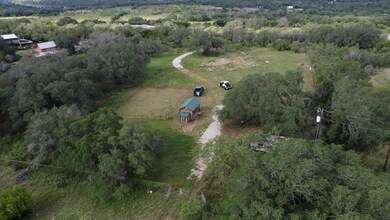 Aerial view of property's location featuring a fo