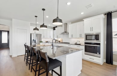 Bright kitchen with an expansive center island perfect for gatherings *Model representation
