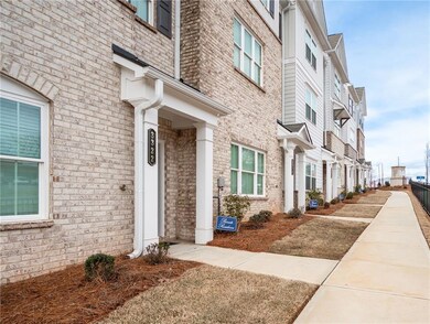 View of exterior entry with brick siding