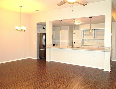 Unfurnished living room with dark wood finished f