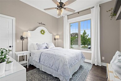 Lovely guest bedroom on main level has a walk in c