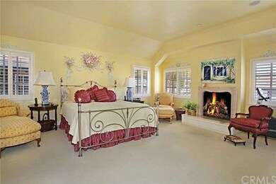 Spacious master suite with fireplace and balcony