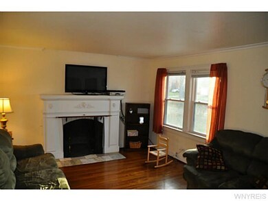 Living Room. Hardwood flooring and wood burning fi