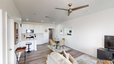 Living room featuring wood-type flooring and ceili