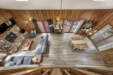 Open floor plan with stone hearth, french doors, s