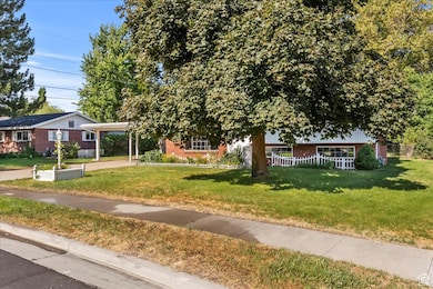 View of front of home featuring brick siding and a front lawn