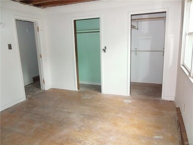 Bedroom With Hardwoods & Double Closet