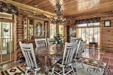formal dining room with antler chandelier