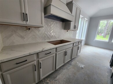 Sleek light grey cabinets and included cabinet hardware!