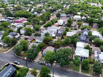 Aerial view of residential area with property par