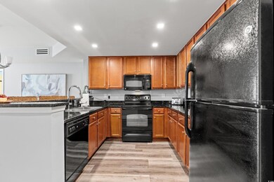 Kitchen featuring sink, black appliances, kitchen 