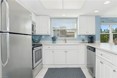 Kitchen with white cabinetry, stainless steel appl
