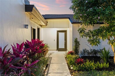 Entrance to property with roof with shingles