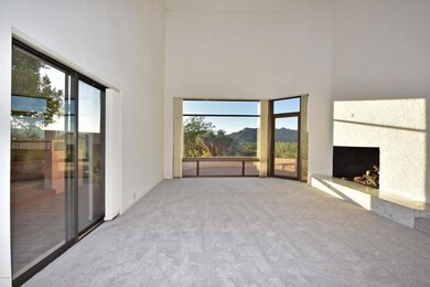 Formal living room w/very high ceilings.