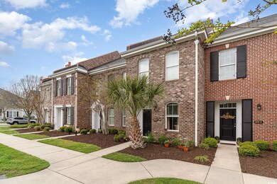 View of property featuring brick siding