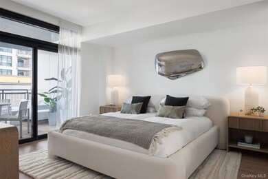 Bedroom featuring wood finished floors and access to outside