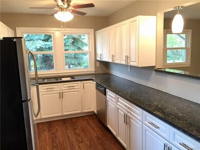 Undermount sink and dishwasher included.