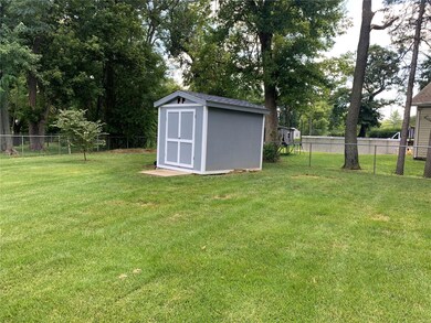 Cute garden shed is perfect for storing lawn equip