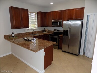 What a great garanite kitchen with stainless appli