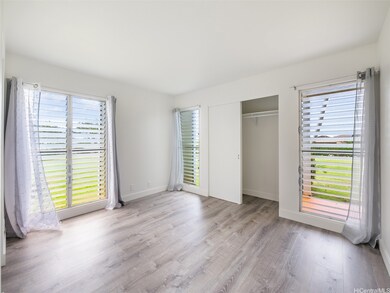 Primary bedroom with lots of windows