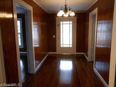 Entry. Wood flooring thru out except for baths and kitchen.