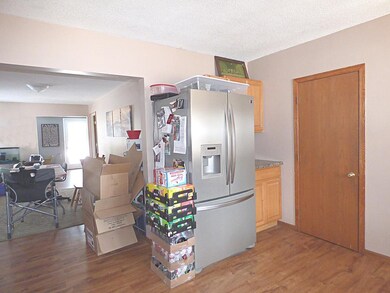 Kitchen to dining room photo.