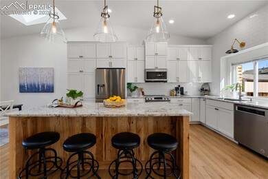 Kitchen featuring stainless steel appliances, ligh