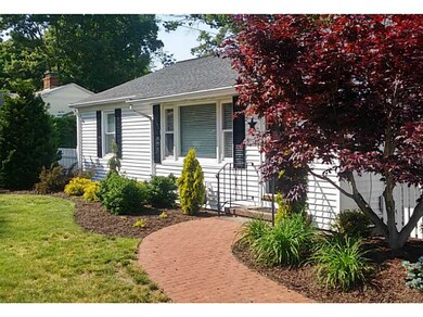 Exterior Front. Pretty brick paver walkway creates
