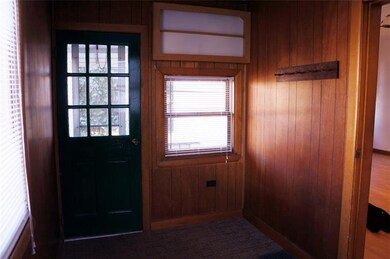 Enclosed front porch area
