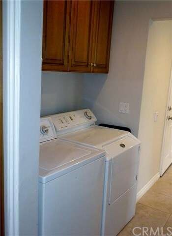 Laundry room between kitchen and family room.