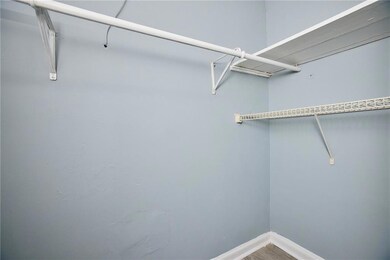 Spacious closet with wood finished floors