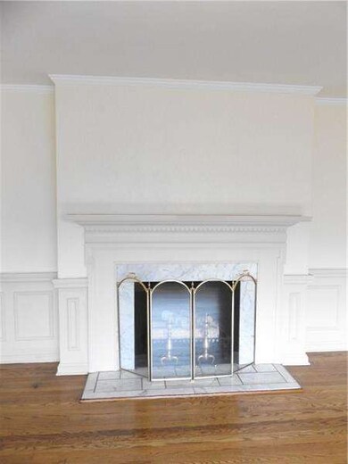 Beautiful marble hearth accents this living room f