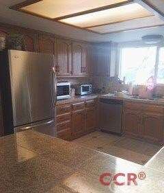 Updated kitchen with stainless steel appliances.