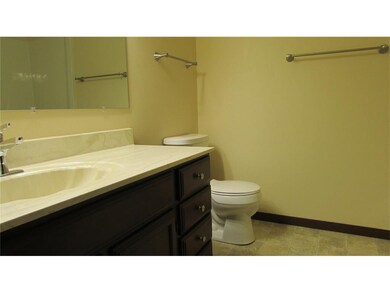 Main bath with large vanity and tub.