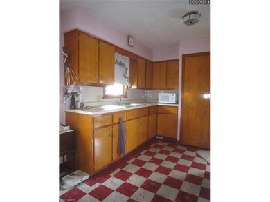 View of maple kitchen cabinets.