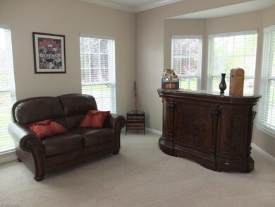 Living room with French doors, crown molding and b