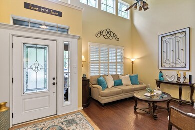 Impressive 2-story foyer opens up to both formals
