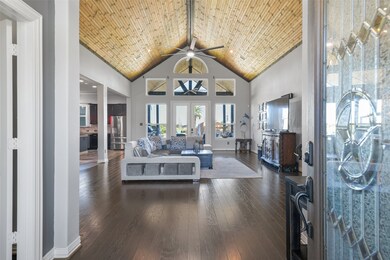 A beautiful Texas-themed leaded glass door opens f