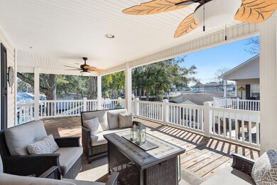 Wooden deck with ceiling fan and an outdoor living
