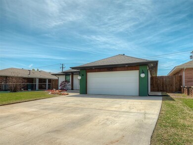 View of front of property with fence, an attached 