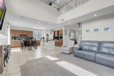 Living area featuring light tile patterned floors,