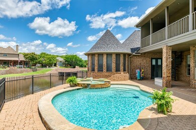 View of Pool featuring a Spa, Decking and Covered Patio