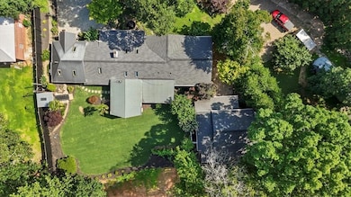 Main home and guest house with newly sodded back yard.