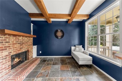 Unfurnished room featuring baseboards, a fireplace