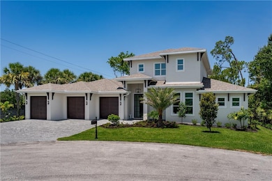 Prairie-style home featuring decorative driveway, a front yard, a garage, a shingled roof, and stucco siding