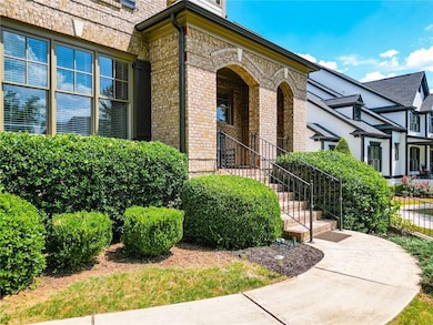 View of exterior entry featuring brick siding
