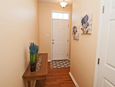 WELCOME YOUR GUESTS INTO THE ENTRY WITH HARDWOOD F